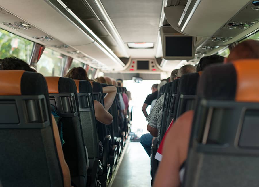 interior of a bus rental with TV screens
